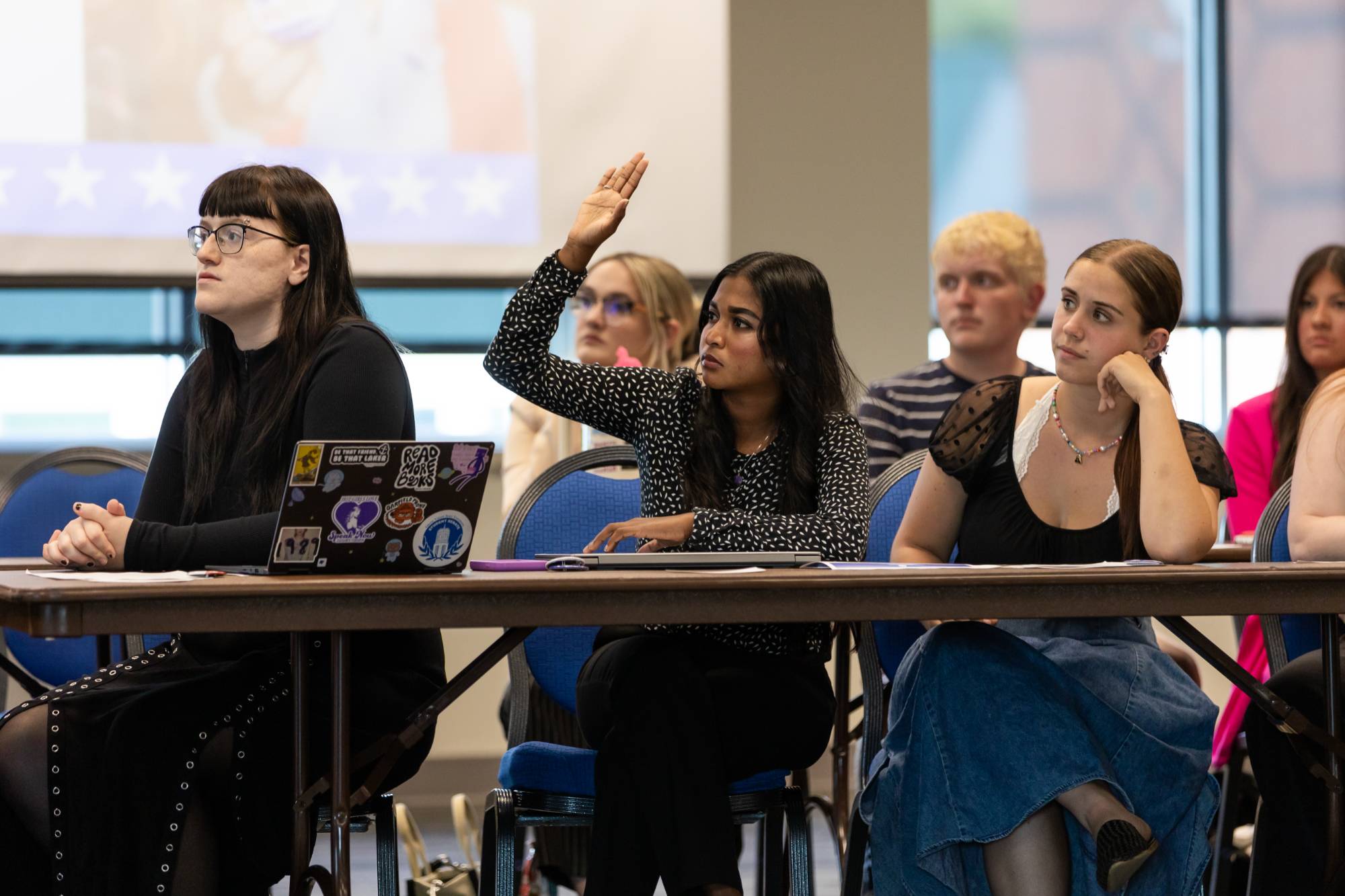 Senator Immaculata James raises her hand to ask a question during a General Assembly meeting.